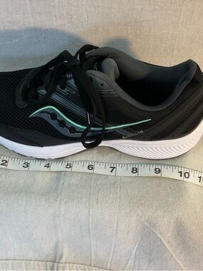 Saucony Women’s running shoes, black with mint green, size 
9-9.5WIDE A+